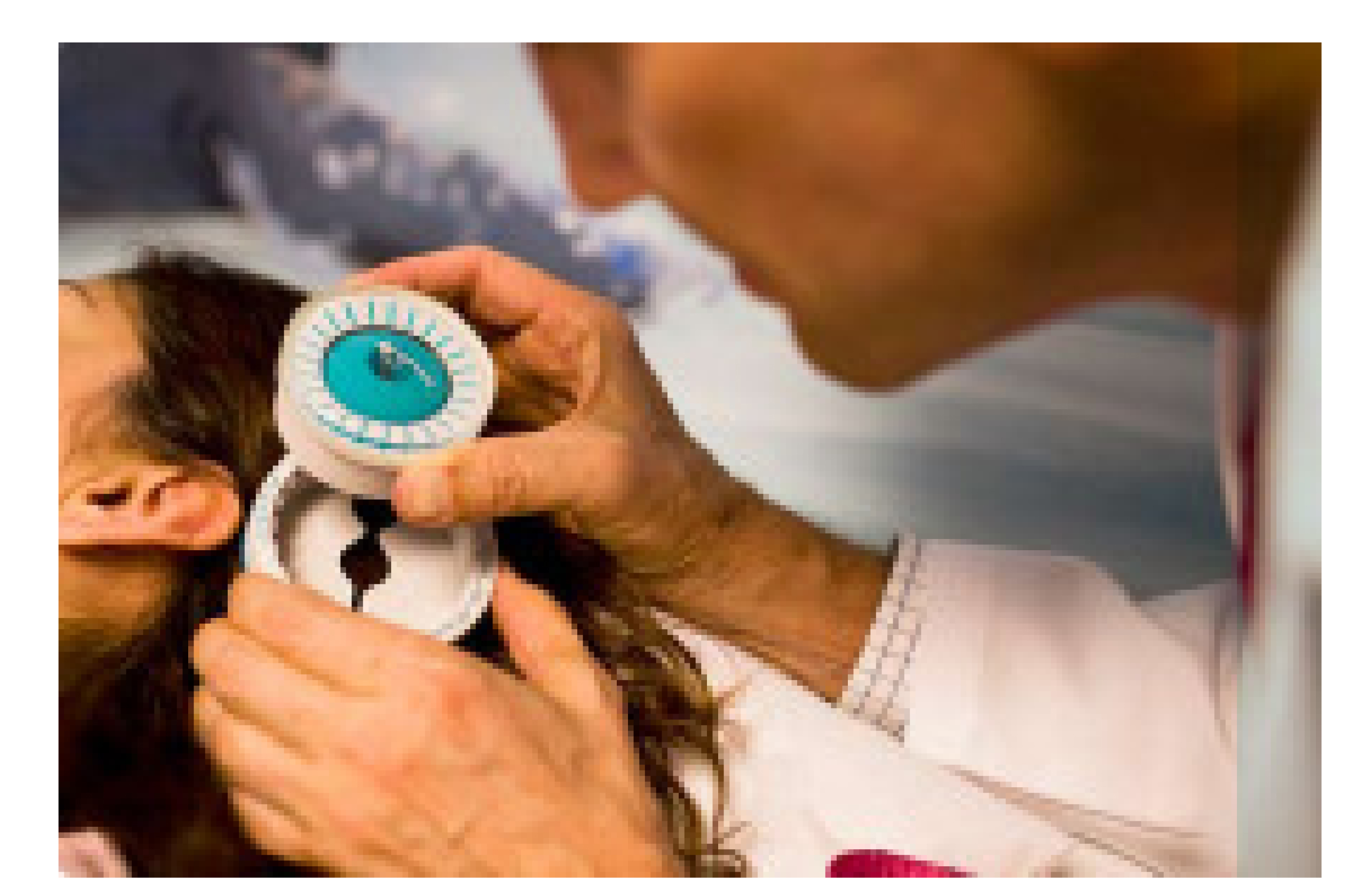 doctor using magnet on head of pediatric patient