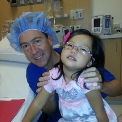 Rebecca's precious daughter, Hana, with Dr. David Gibbs, CHOC Children's Specialists Division Chief of Surgery. Hana was the first patient to have surgery in the new OR in the Bill Holmes Tower. 