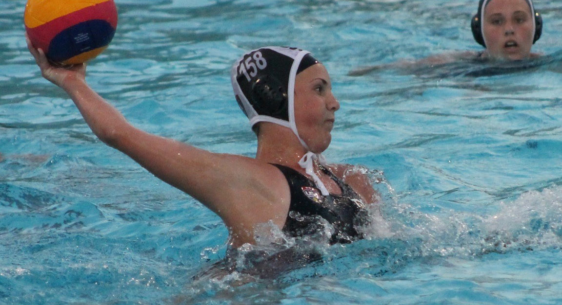 Nikki throwing a ball while playing water polo