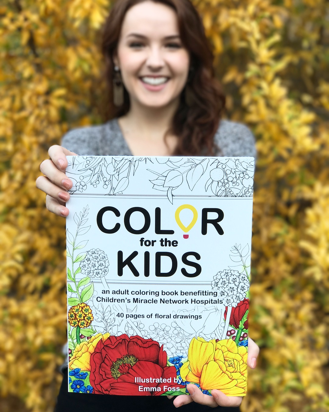 choc-childrens-volunteer-with-coloring-books-as-donation-to-choc