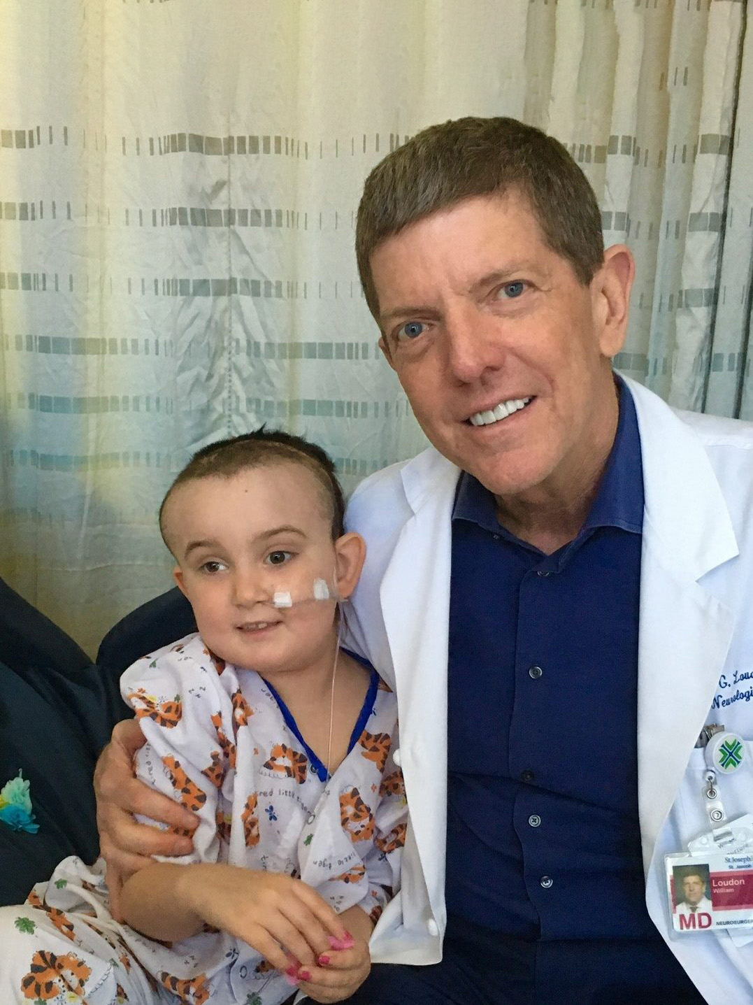 “Miracle Maddy” with her pediatric neurosurgeon, Dr. William Loudon