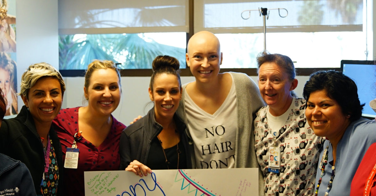 CHOC patient Brianna with team of CHOC nurses celebrating her last chemo treatment