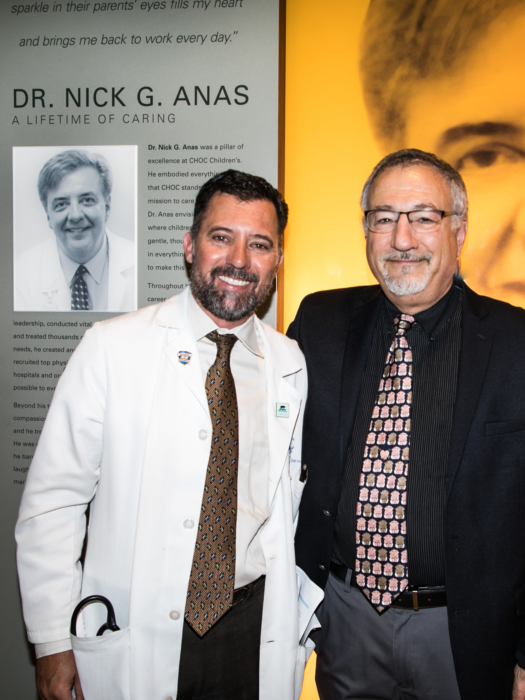 Dr. Knight and Dr. Lubinsky standing in front of the Nick Anas wall dedication