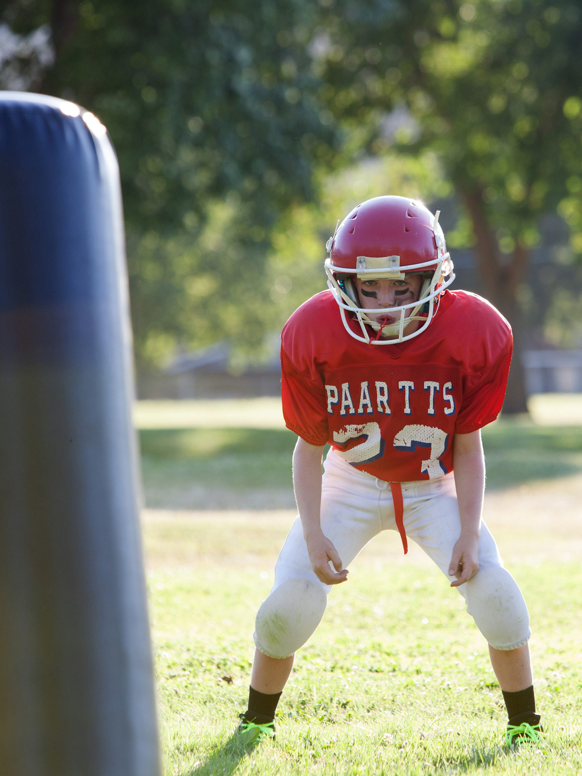 Youth football player preparing to make a tackle