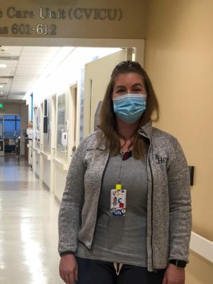 CHOC CVICU nurse, Amanda, standing in front of the CVICU entrance