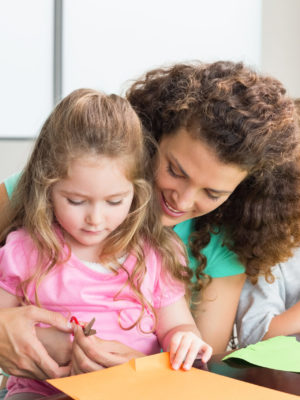 Mom and daughter making paper crafts