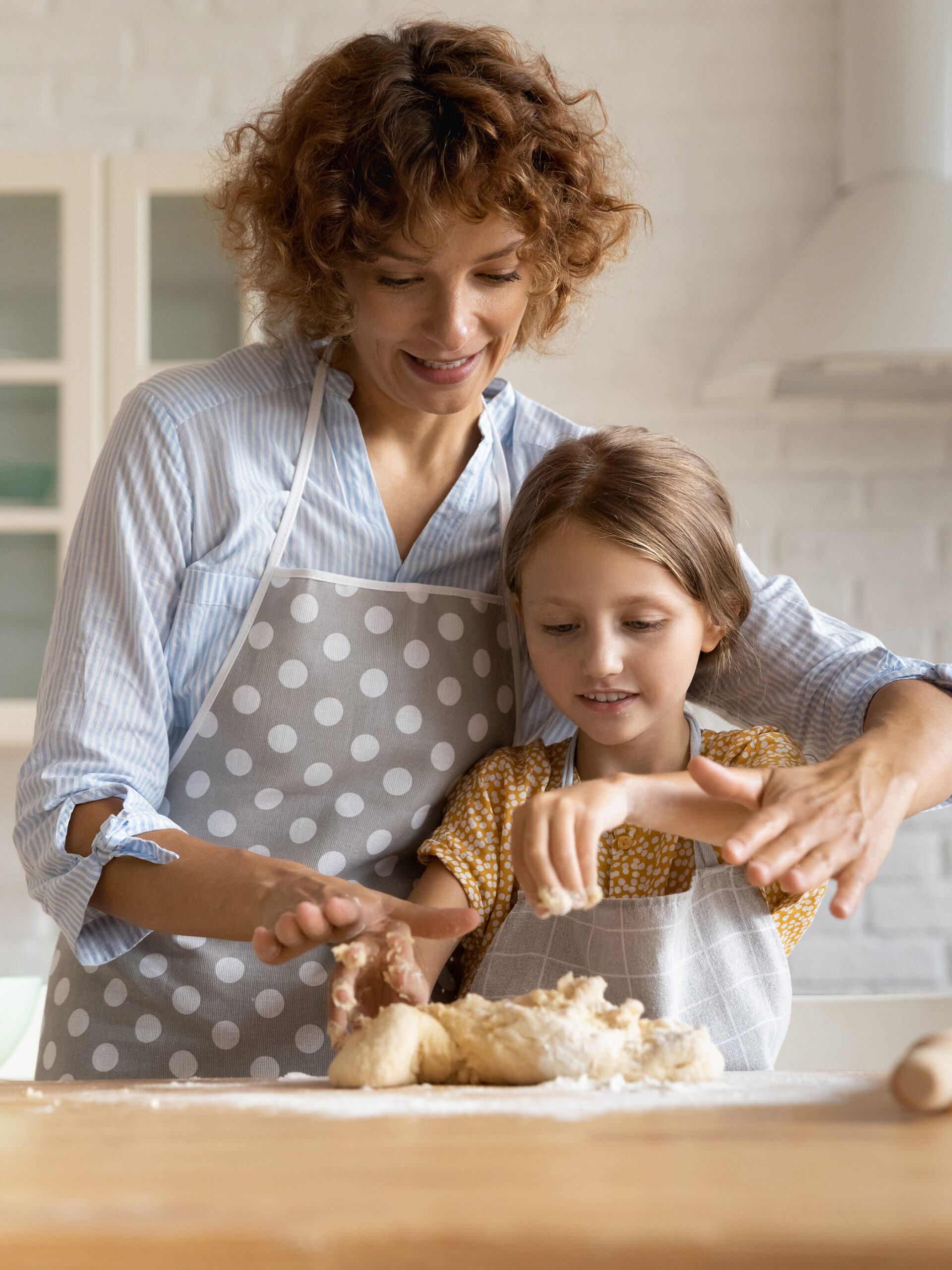 Parent and child bake together in kitchen - comfort baking with a healthier twist