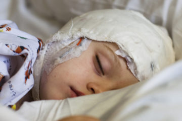 How can I help my child stay awake before an EEG?