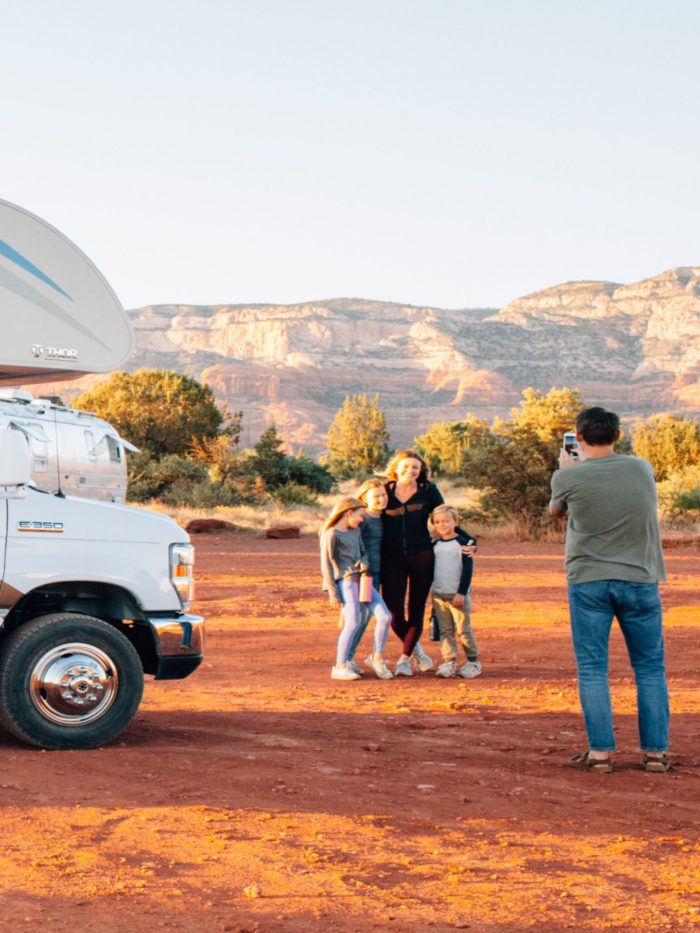 Family taking picture outside of RV