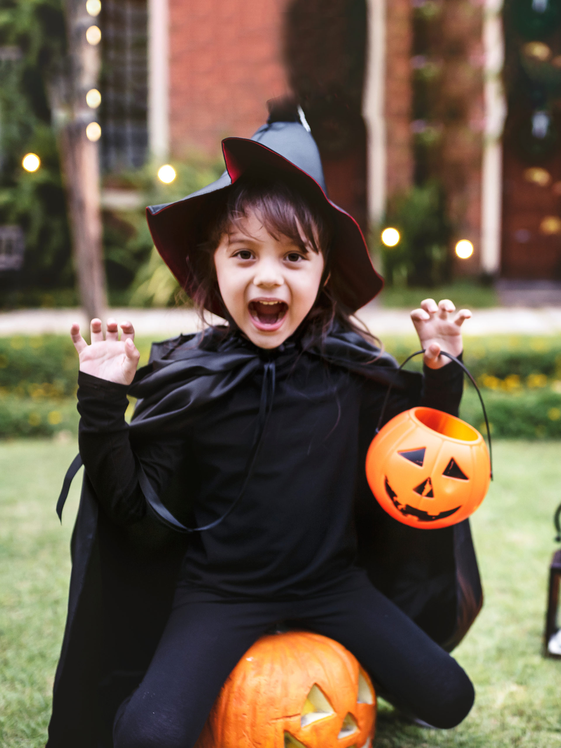 Girl dressed as a witch celebrates Halloween