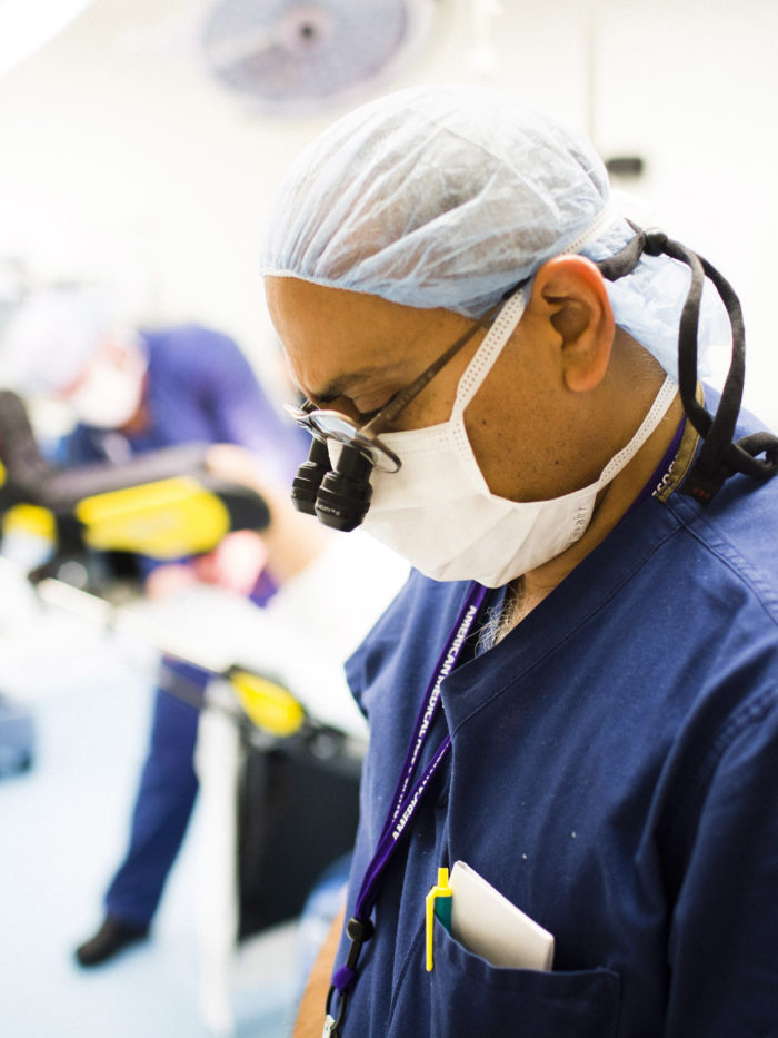 closeup of CHOC pediatric surgeon focused while performing surgery
