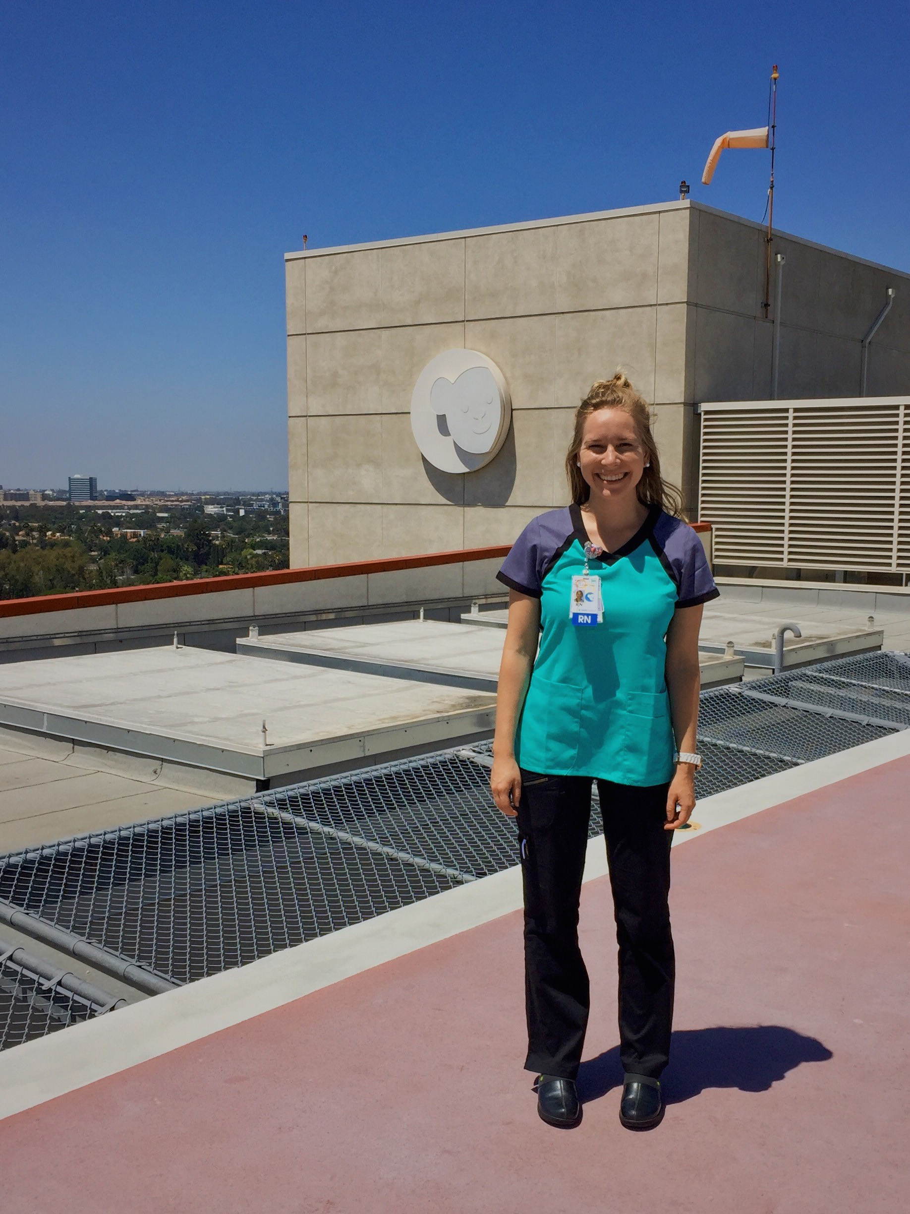 CHOC PICU nurse Katelyn standing on roof of CHOC hospital