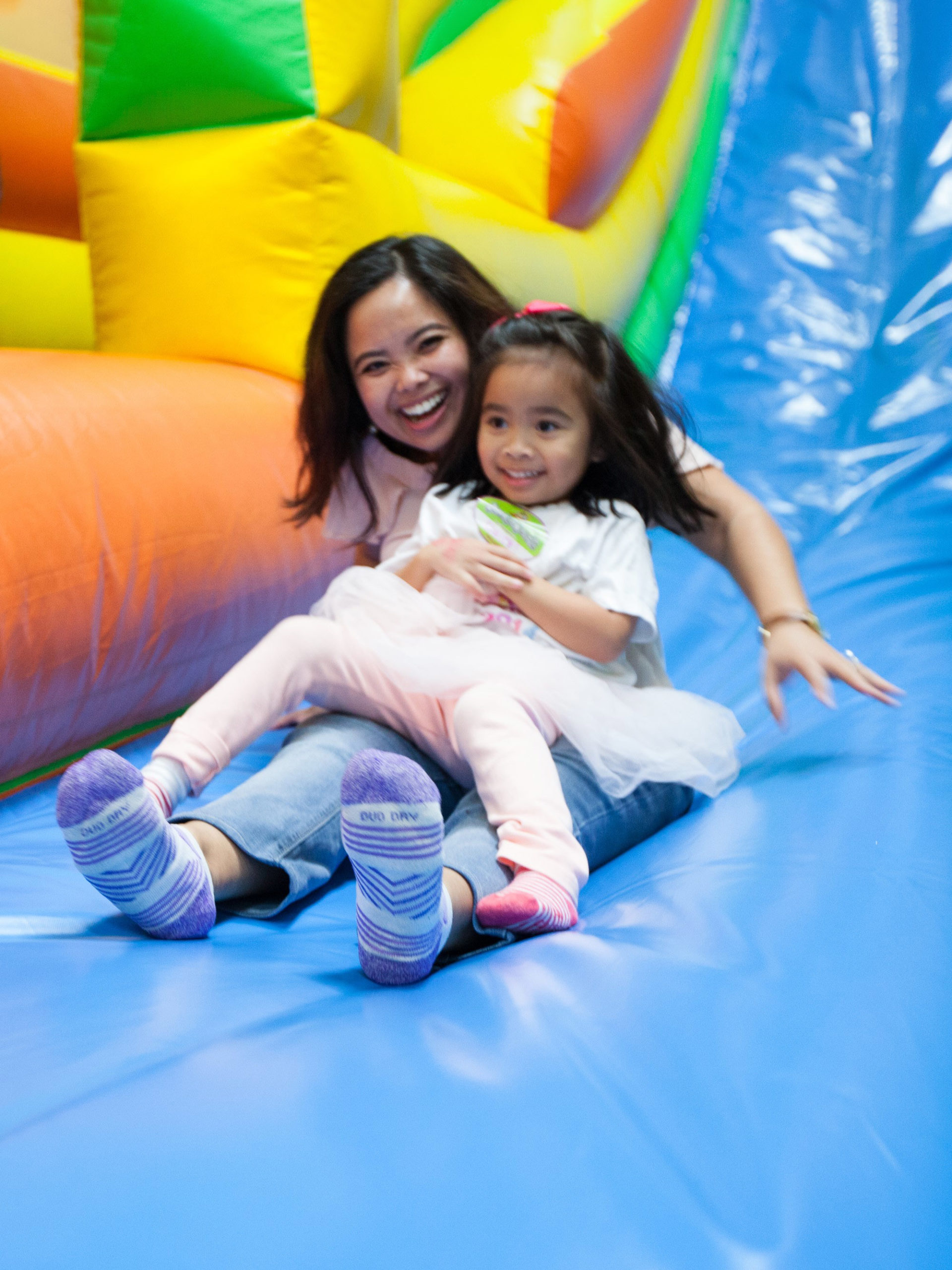 CHOC pediatrician Dr. Herrera sliding down slide with her daughter
