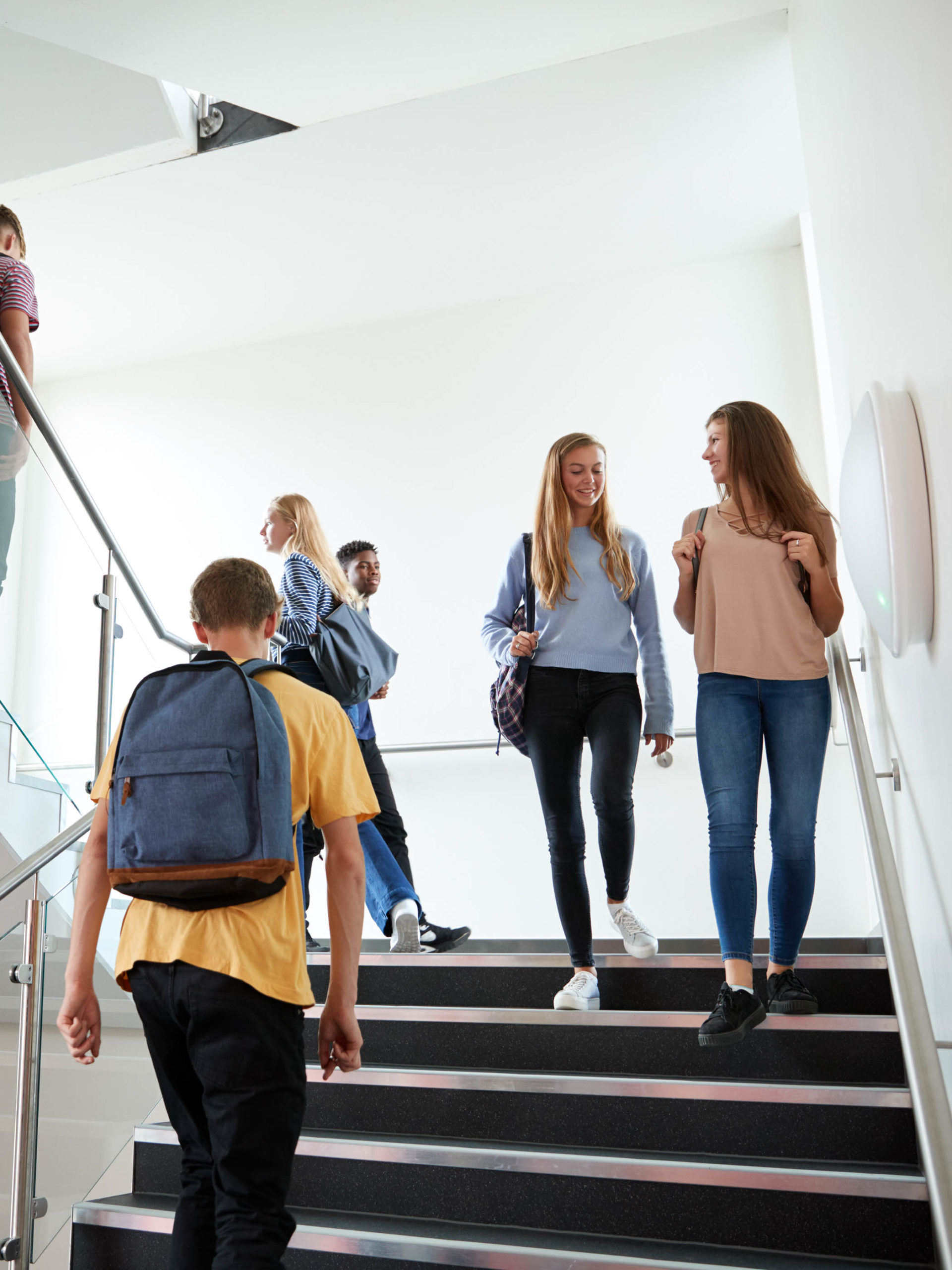 High School Students Walking On Stairs Between Lessons