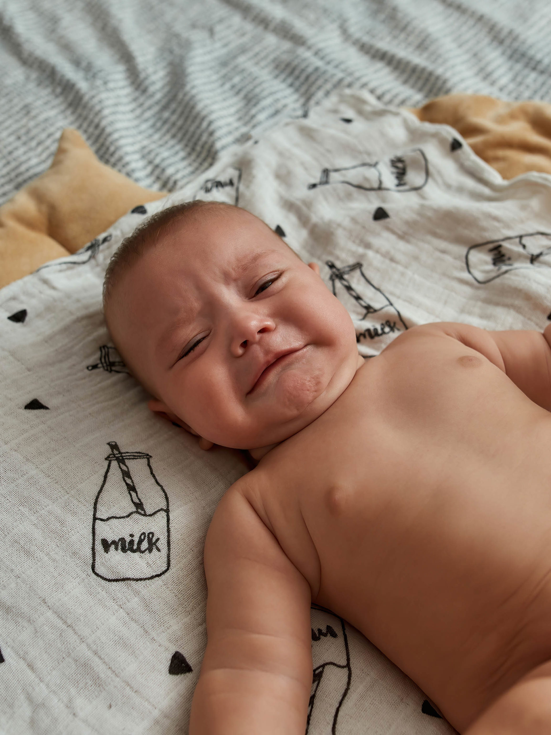 distraught baby waiting for someone to help releive pain and discomfort
