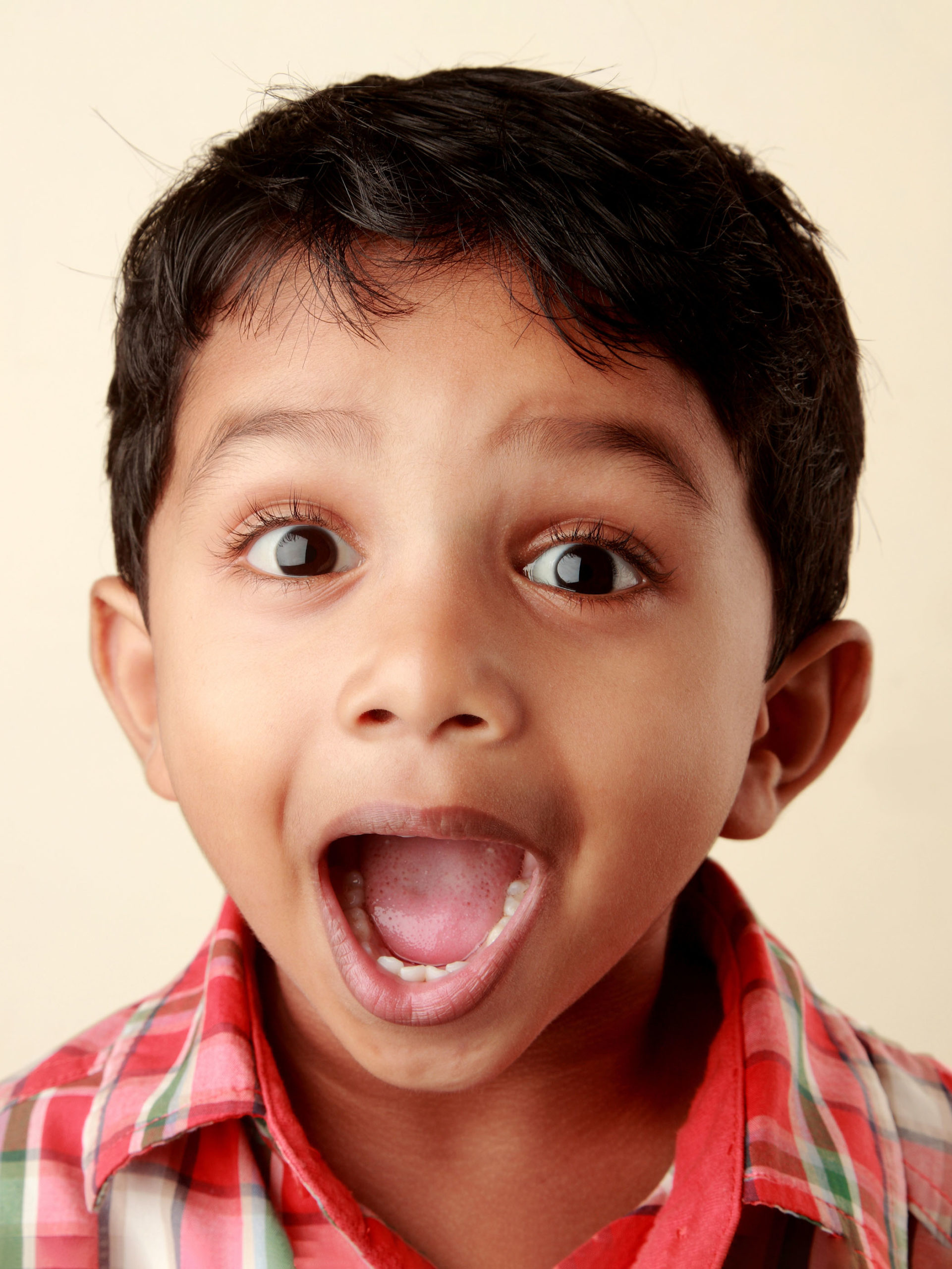 small boy with mouth open overjoyed