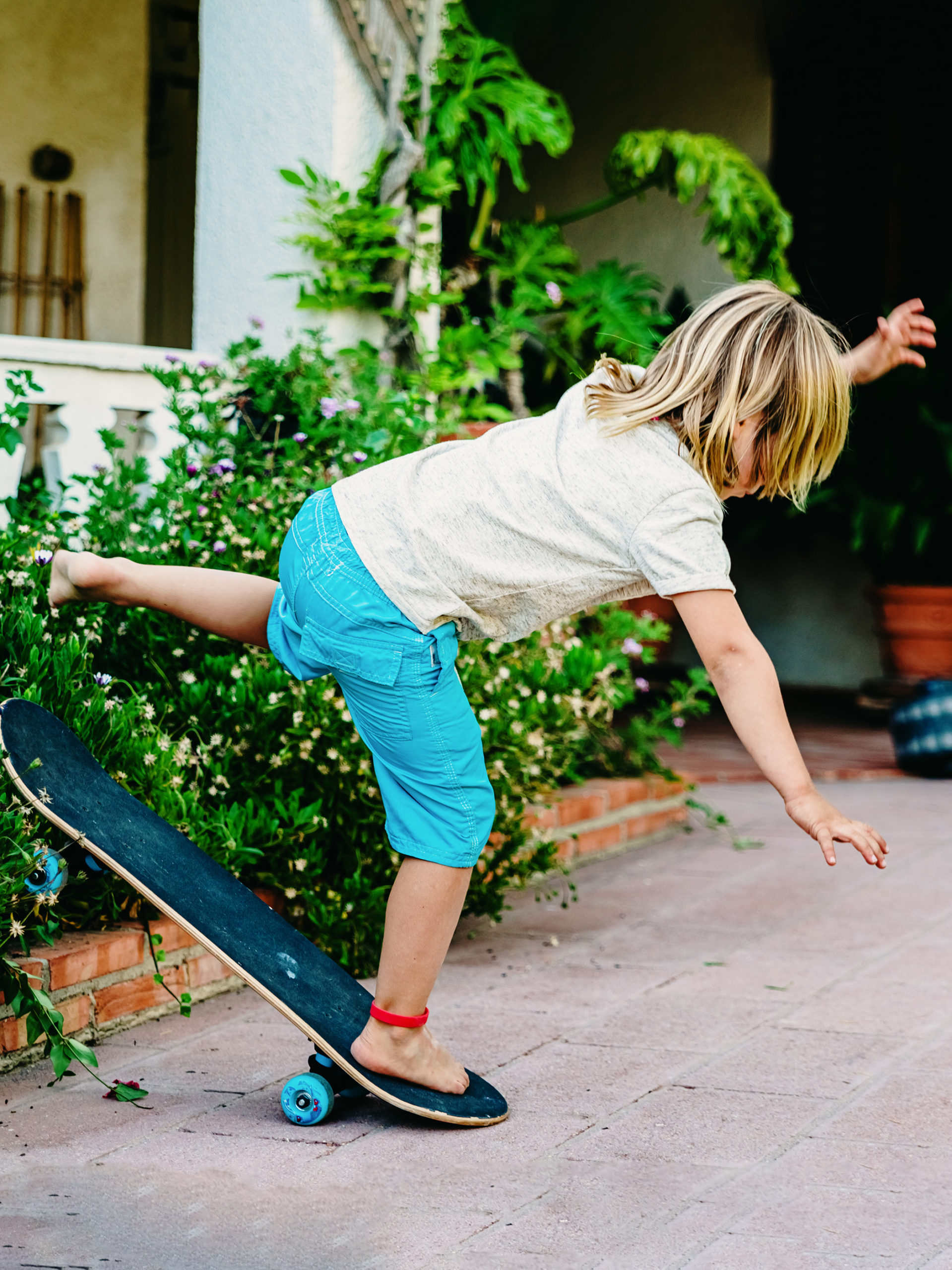 boy falls off of skateboard