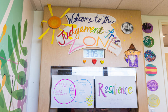 Sign saying "Welcome to the judgement-free zone" hanging in the art studio at CHOc's mental health inpatient Center 