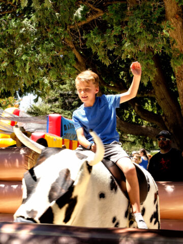 Child on mechanical bull. Mechanical bulls may be dangerous for kids.