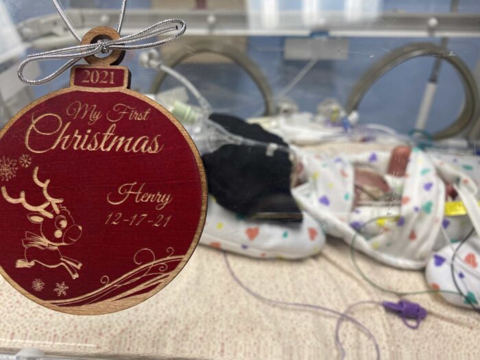 Henry in NICU with "My first Christmas ornament"