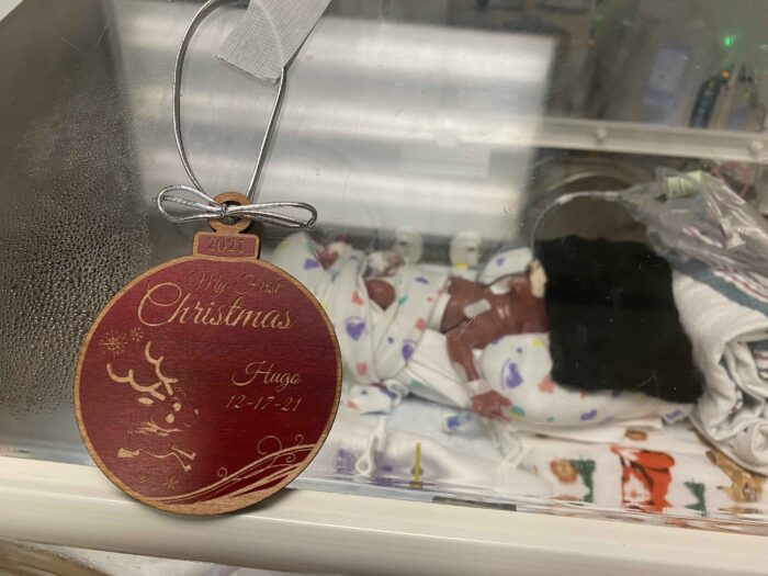 Hugo in NICU with "My first Christmas ornament"