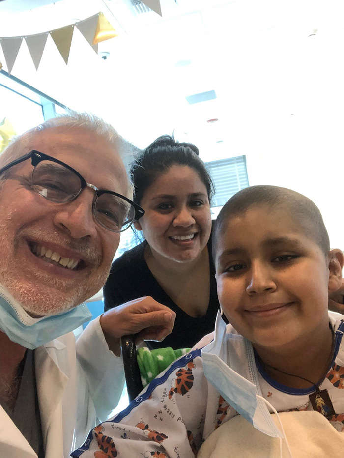 Dr. Arrieta, Cindy and Kenny smile in a selfie together