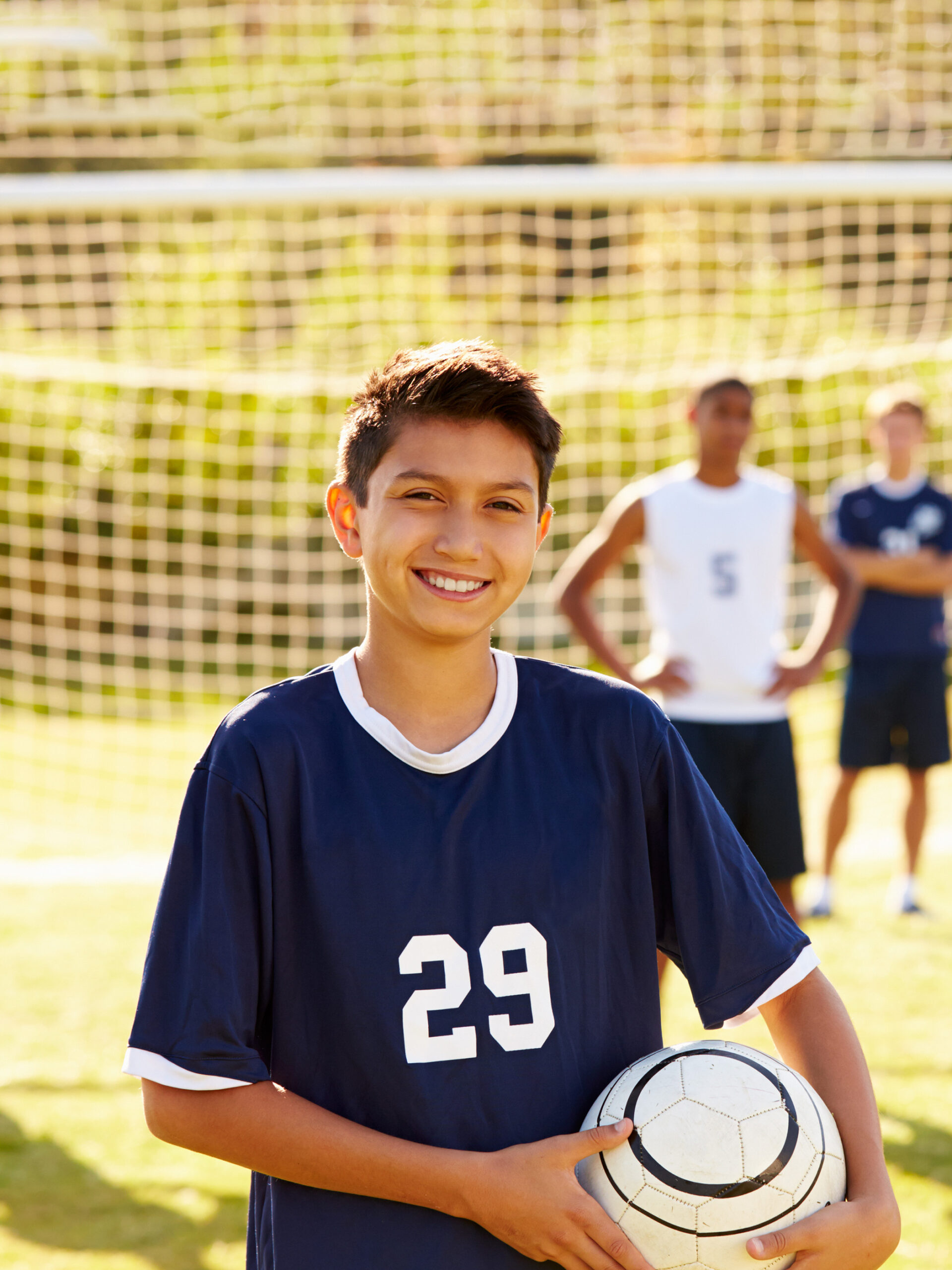 Teen poses with soccer ball - CHOC's advice for preventing athlete burnout