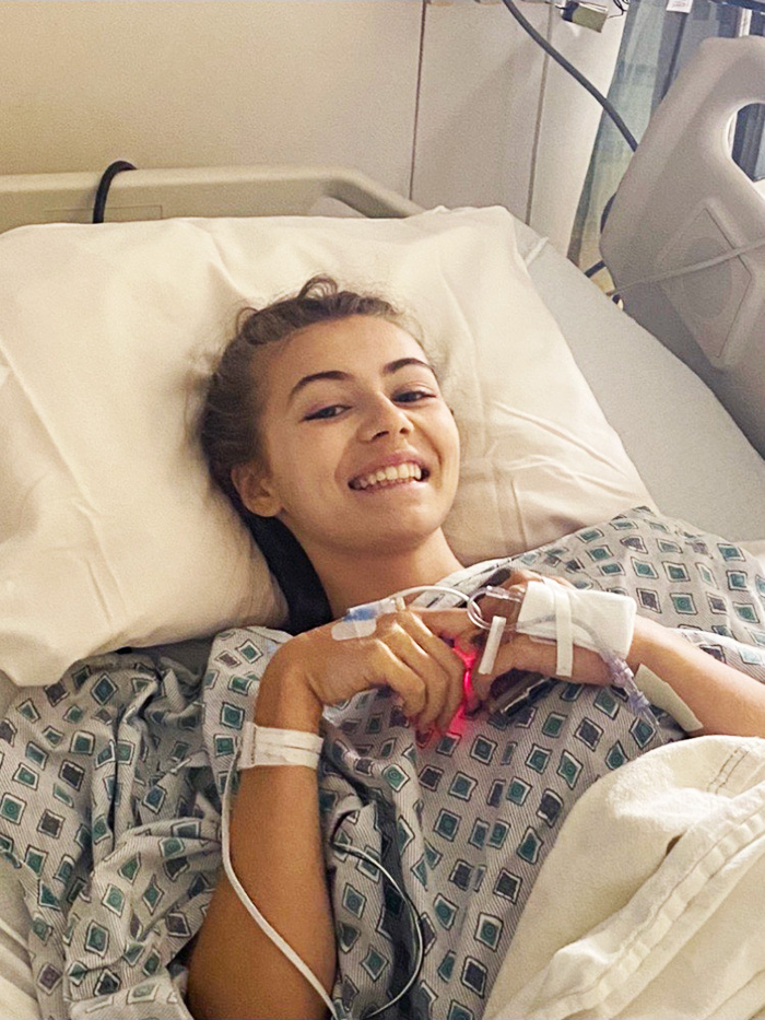 Sarah smiles while waiting for scoliosis surgery at CHOC 
