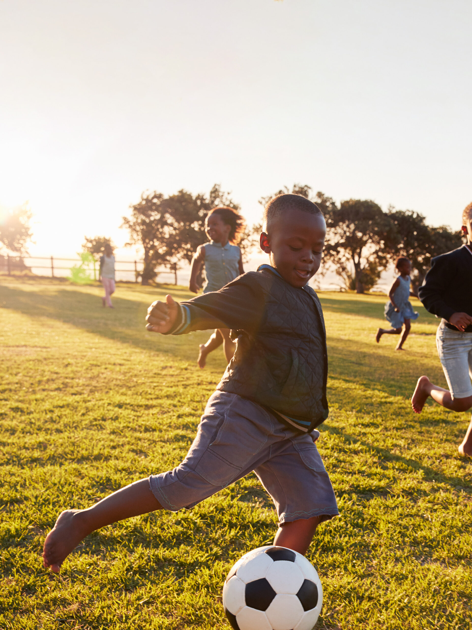 Child playing soccer - Physical activity for stress relief guide from CHOC