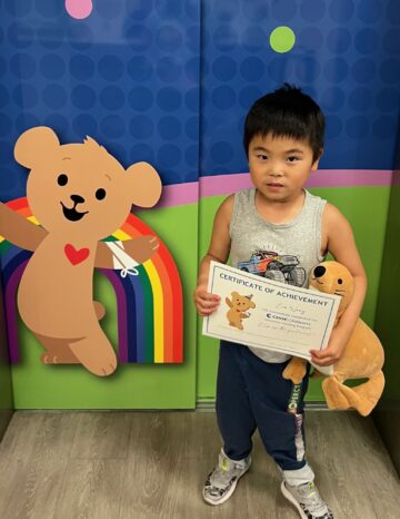 Boy holding certificate