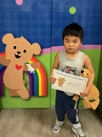 Boy holding certificate