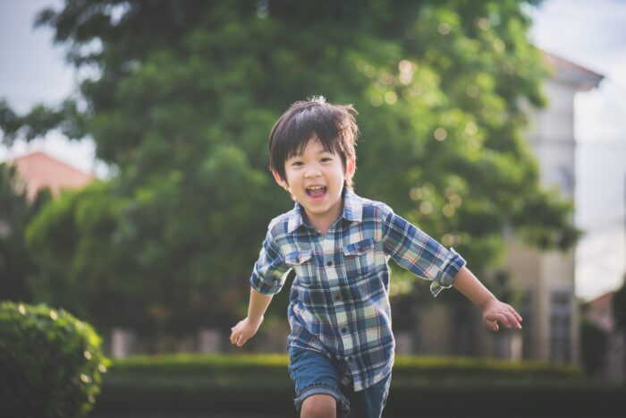 Boy running outside