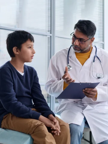 doctor and child talking 