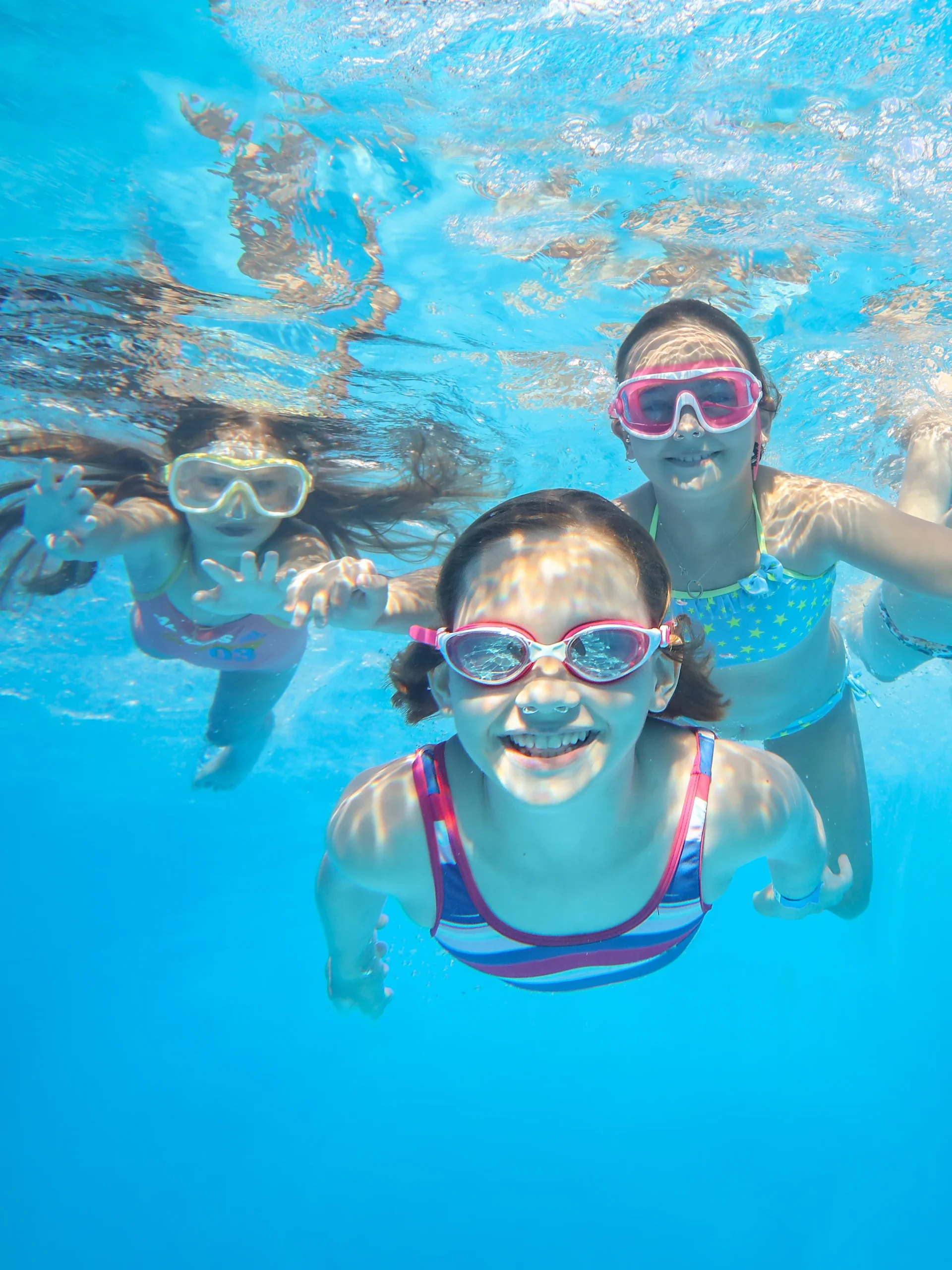 Girls underwater while swimming