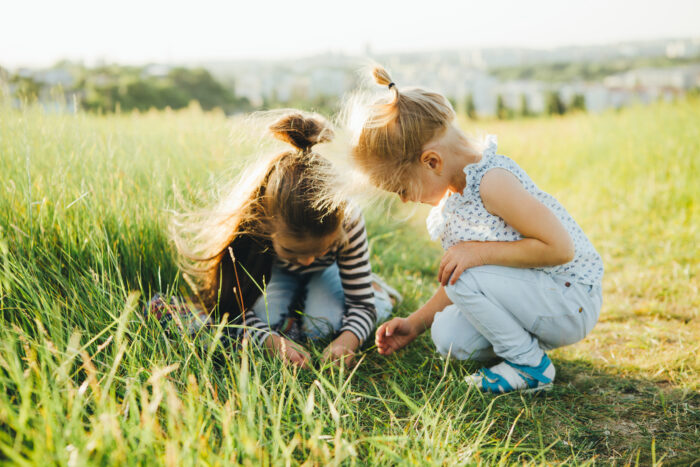 Kids looking at grass