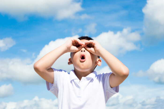 Child looking at clouds