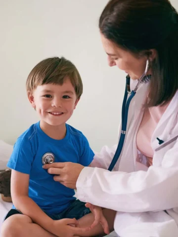 Doctor giving child a checkup