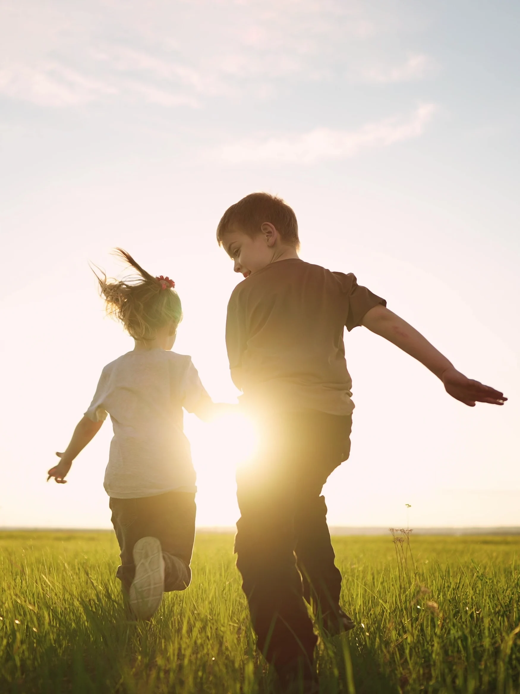 Kids running in field