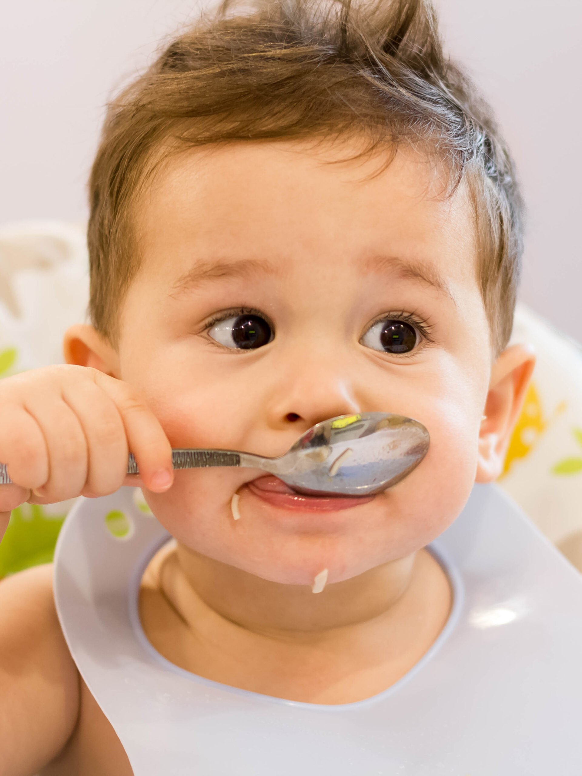 Toddler eating rice