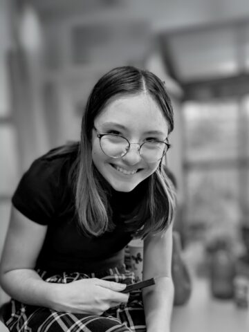 Girl with short hair and glasses