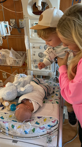 Dawson meeting his younger brother, Meyer, for the first time.