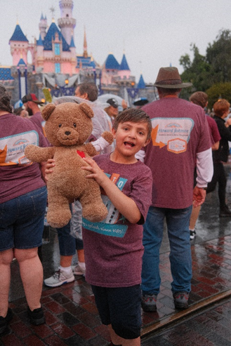 Ezra, who has undergone three open-heart surgeries, strikes a pose with Choco at the CHOC Walk in the Park, presented by Disneyland® Resort.