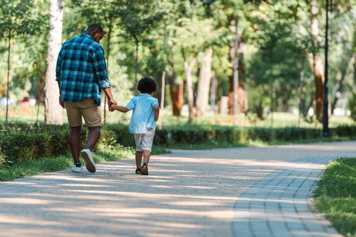 Son and dad taking a walk 