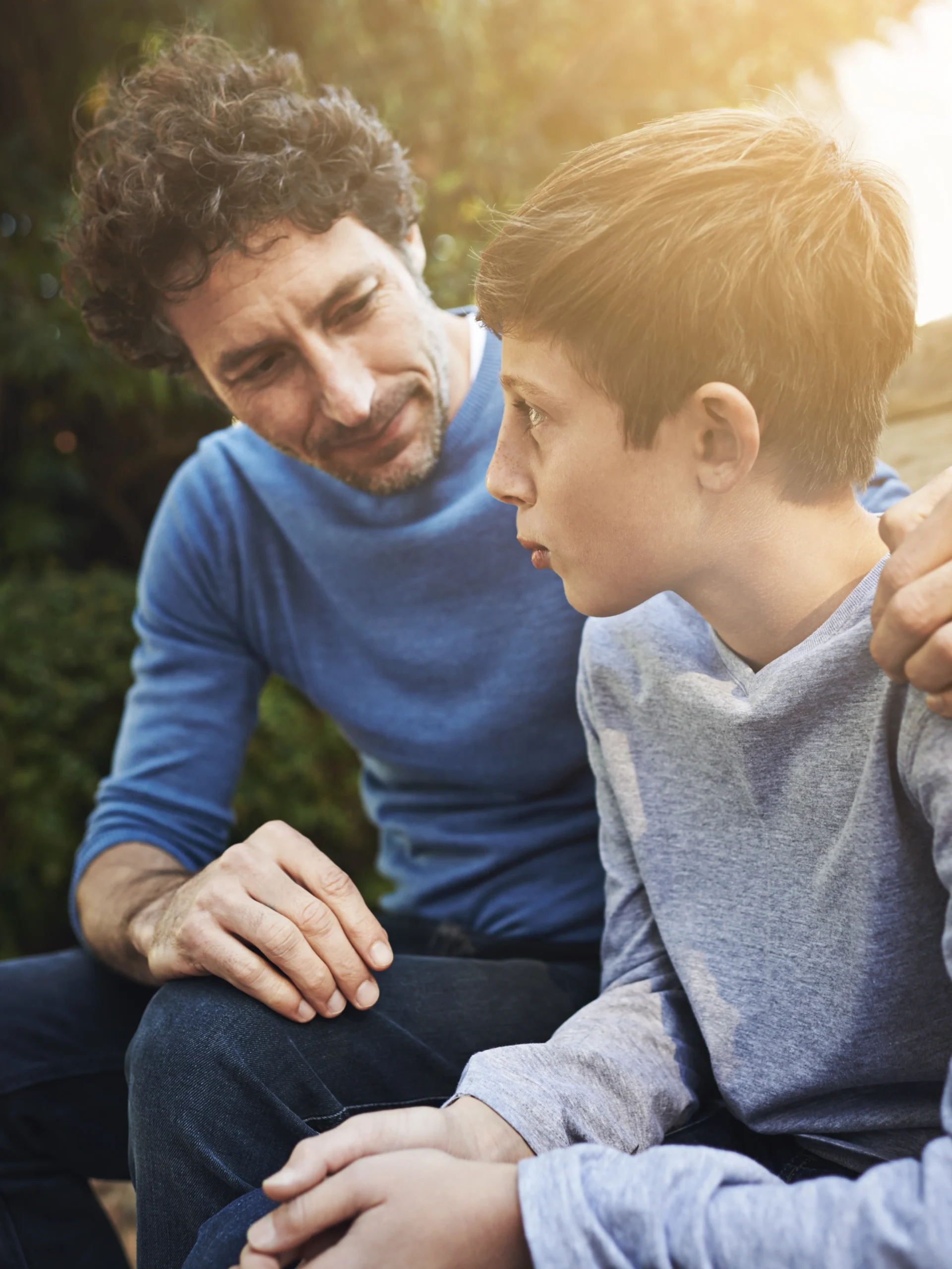 Dad and son talking