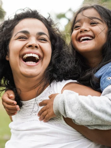 Mother and child smiling