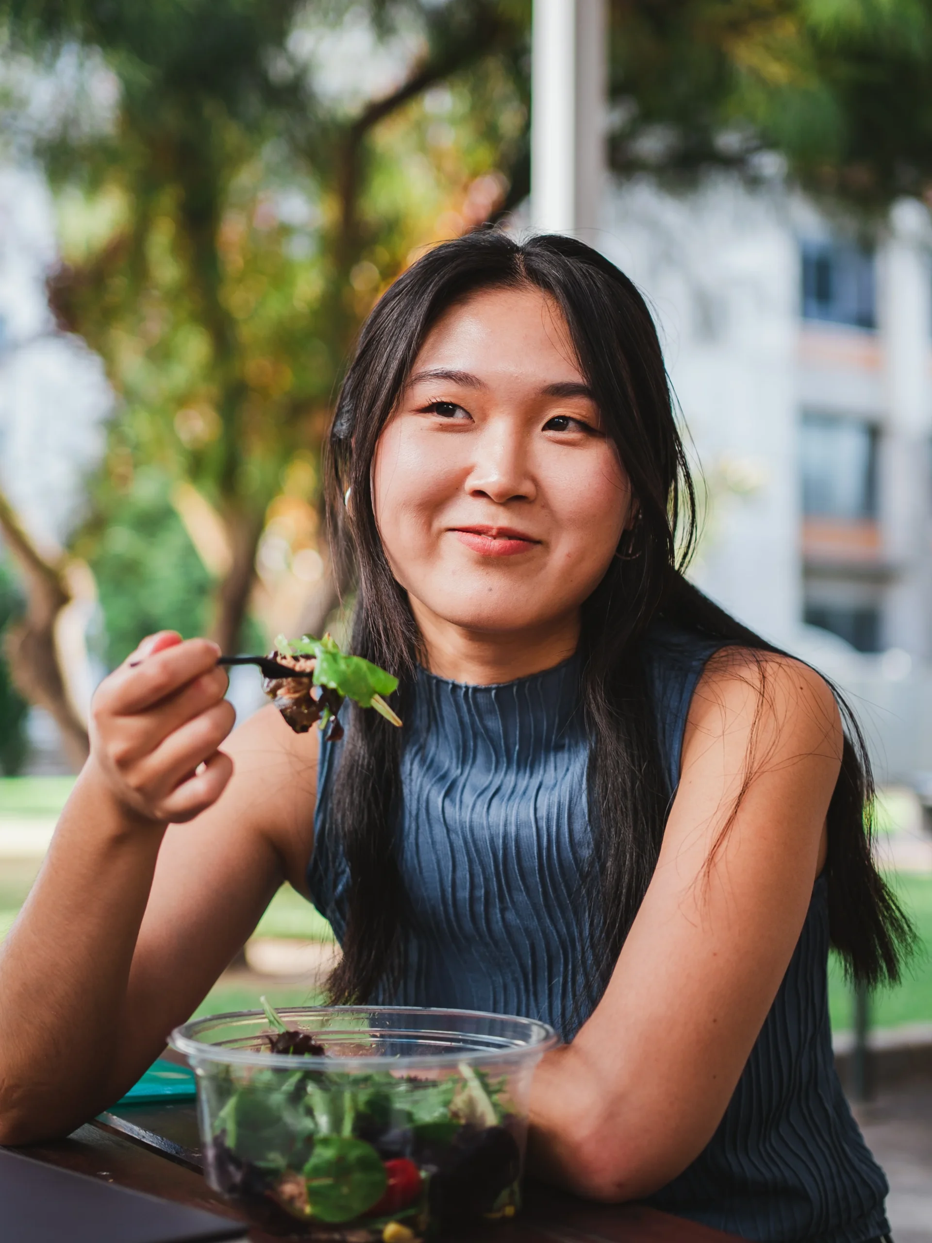 Teen eating salad