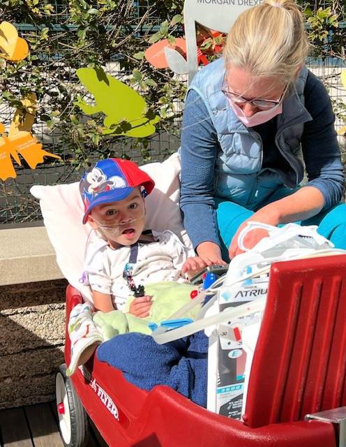CHOC CVICU nurse Cynthia with patient, Elijah