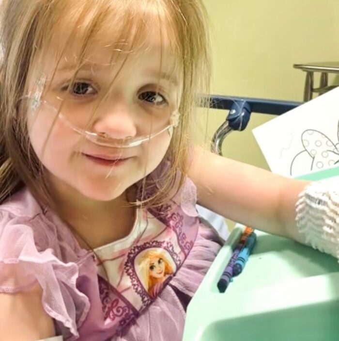 Amelia bringing her imagination to life through coloring