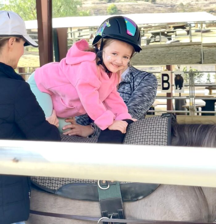 Amelia on horseback