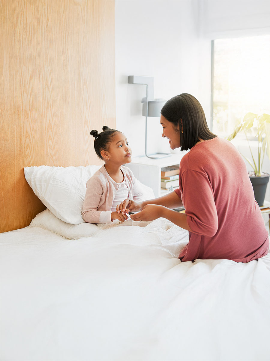 Care, health and diabetic girl talking and bonding with mother, learning to balance her illness. Loving parent caring for her child, teaching her diabetes awareness, doing routine insulin treatment